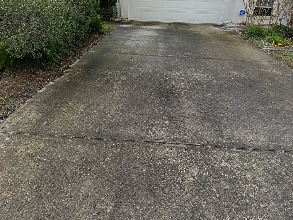 Driveway before pressure washing