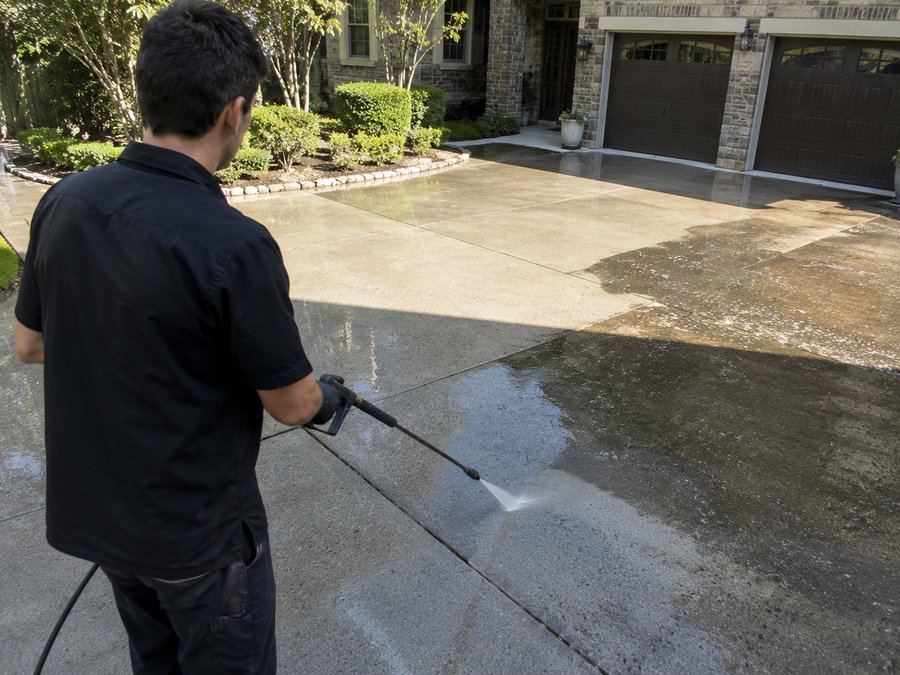 Pressure washing a driveway