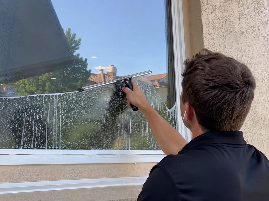 Squeegeeing a window clean